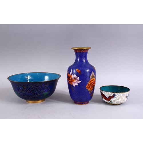 273 - FOUR CHINESE CLOISONNE ITEMS, to include a vase, two bowls and a small dish.