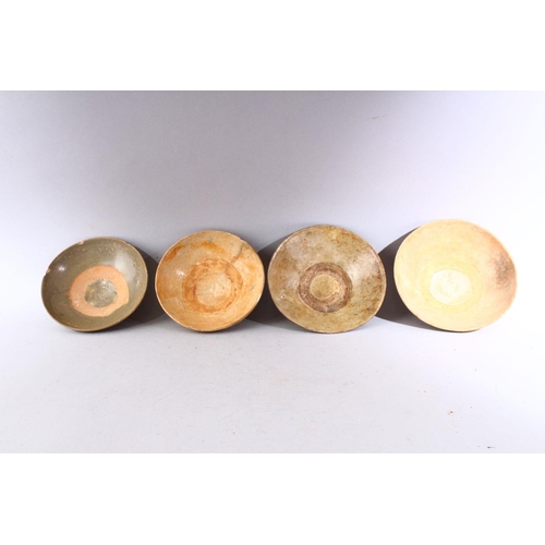 287 - A GROUP OF FOUR EARLY CHINESE EARTHENWARE CIRCULAR BOWLS, various sizes.