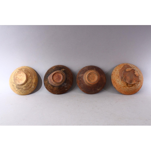 289 - A GROUP OF FOUR EARLY CHINESE EARTHENWARE CIRCULAR BOWLS, various sizes.