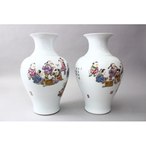 29 - A PAIR OF CHINESE REPUBLIC PERIOD FAMILLE ROSE PORCELAIN VASES OF BOYS PLAYING, the body of the vase... 