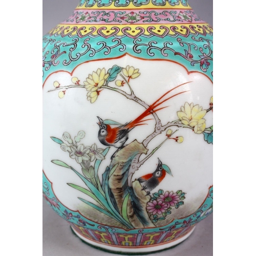 297 - A LARGE 20TH CENTURY CHINESE FAMILLE ROSE BULBOUS SHAPED VASE, painted with panels of birds on flowe... 