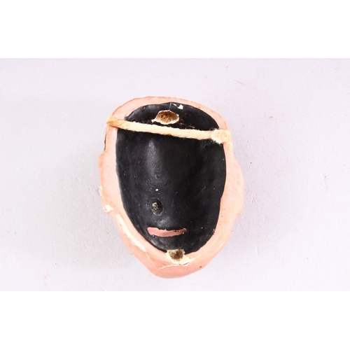 304 - TWO MINIATURE JAPANESE PAINTED PLASTER NOH MASKS, 6cm and 6.5cm high.