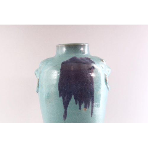 309 - A CHINESE PURPLE SPLASH POTTERY VASE, with moulded lion mask handles, 35cm high.