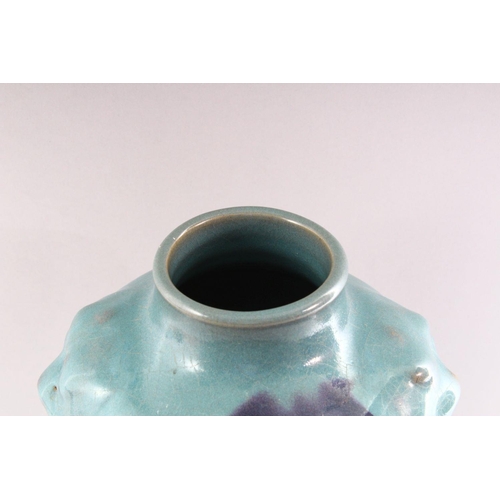 309 - A CHINESE PURPLE SPLASH POTTERY VASE, with moulded lion mask handles, 35cm high.