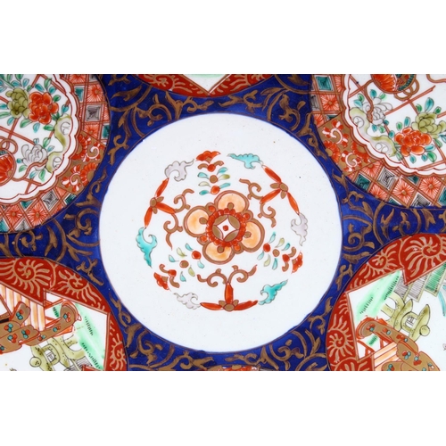 310 - A JAPANESE IMARI CHARGER, with shaped edge, painted with six panels, alternatively painted with fema... 