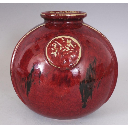 320 - AN UNUSUAL JAPANESE FLAMBE GLAZED & MOULDED STUDIO POTTERY PORCELAIN VASE, 19.8cm wide, 20.3cm high.