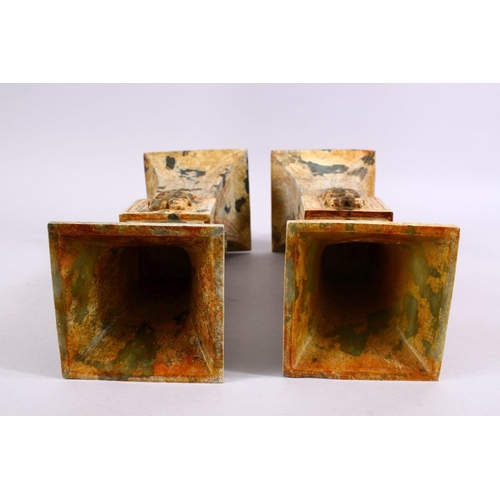 33 - A PAIR OF 19TH / 20TH CENTURY CHINESE ARCHAIC STYLE CARVED JADE VASES, each vase with a central sect... 