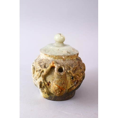 336 - A 19TH / 20TH CENTURY CHINESE CARVED NATURALISTIC TEA POT & COVER, the body carved with fruit decora... 