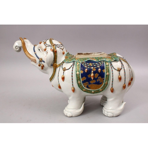 338 - A GOOD JAPANESE MEIJI PERIOD KUTANI PORCELAIN ELEPHANT FIGURE, the figure in a striding pose with ku... 