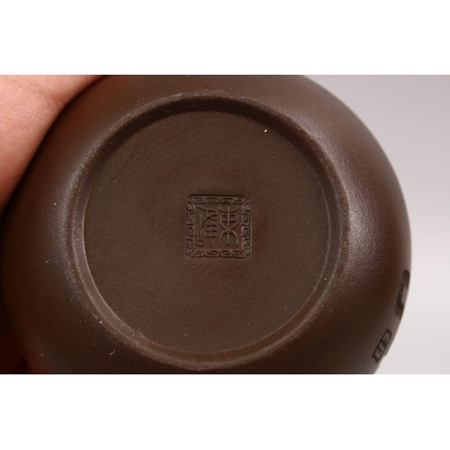 341 - A GOOD CHINESE YIXING CLAY TEAPOT, with carved symbol, base with impressed mark, 10cm wide.