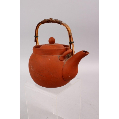 342 - A GOOD CHINESE YIXING CLAY TEAPOT, with carved decoration of landscapes, the base signed, 15cm high ... 