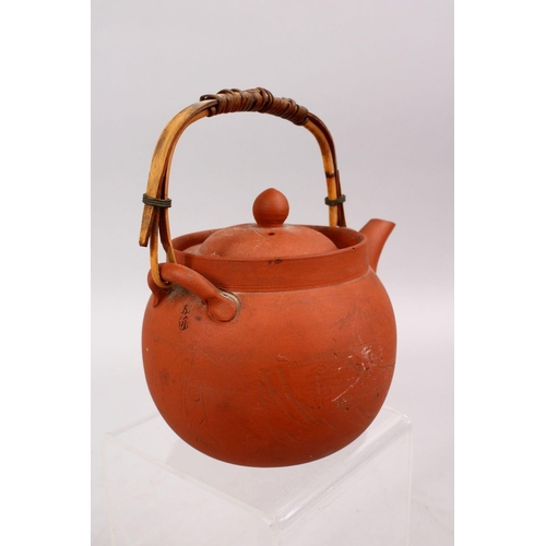 342 - A GOOD CHINESE YIXING CLAY TEAPOT, with carved decoration of landscapes, the base signed, 15cm high ... 