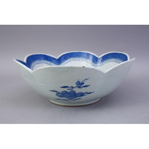 343 - AN 18TH CENTURY CHINESE BLUE AND WHITE PORCELAIN LOBED EDGE BOWL, the bowl decorated with landscapes... 