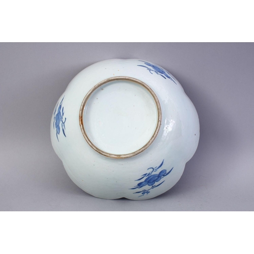 343 - AN 18TH CENTURY CHINESE BLUE AND WHITE PORCELAIN LOBED EDGE BOWL, the bowl decorated with landscapes... 