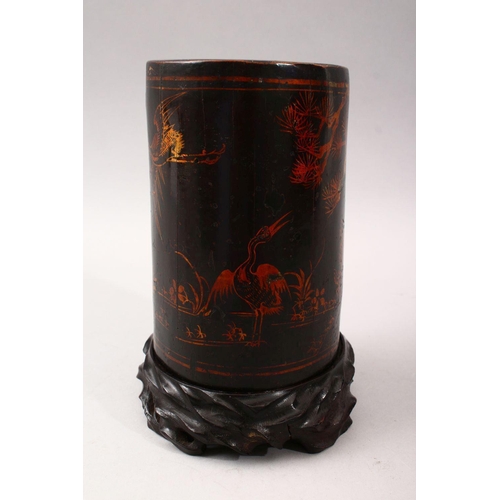 348 - A GOOD 19TH CENTURY CHINESE LACQUER BRUSH POT & STAND, The pot decorated with gold lacquer to depict... 