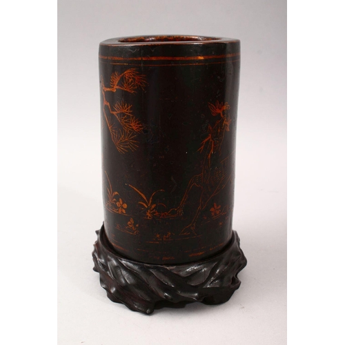 348 - A GOOD 19TH CENTURY CHINESE LACQUER BRUSH POT & STAND, The pot decorated with gold lacquer to depict... 