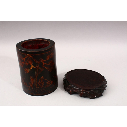 348 - A GOOD 19TH CENTURY CHINESE LACQUER BRUSH POT & STAND, The pot decorated with gold lacquer to depict... 