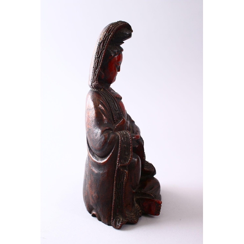 349 - A 19TH CENTURY CHINESE CARVED WOOD & LACQUER FIGURE OF GUANYIN, in a seated position, with carved wa... 