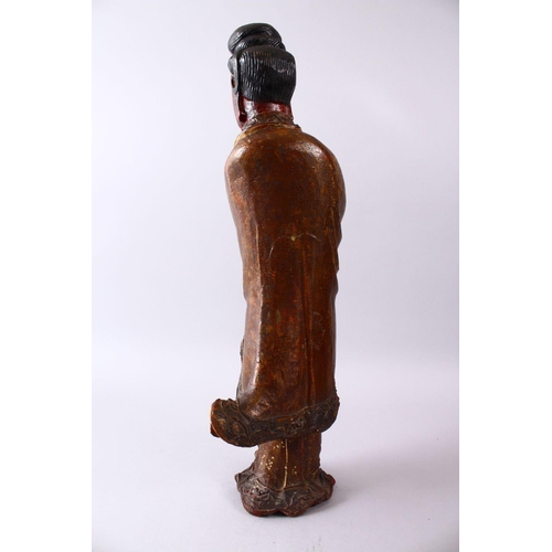 35 - A LARGE 19TH CENTURY CHINESE CARVED AND LACQUERED WOODEN FIGURE OF GUANYIN, with carved wave decorat... 