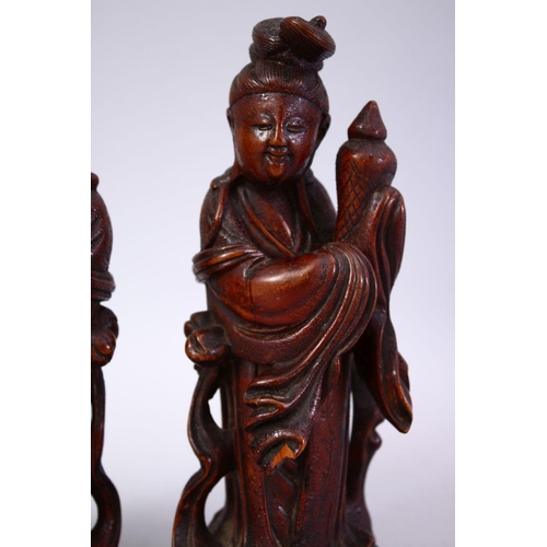 356 - A PAIR OF CHINESE 19TH CENTURY CARVED WOODEN FIGURES, 22cm high