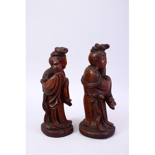 356 - A PAIR OF CHINESE 19TH CENTURY CARVED WOODEN FIGURES, 22cm high