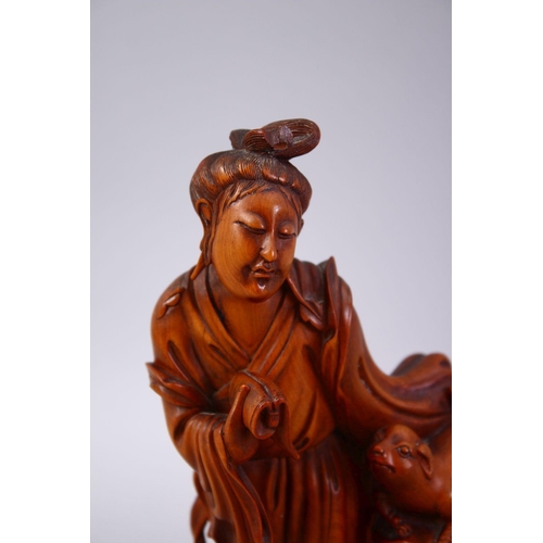 357 - A CHINESE CARVED WOODEN FIGURE OF GUANYIN & ANIMAL, stood aside a tree stump with an a animal, 20cm ... 