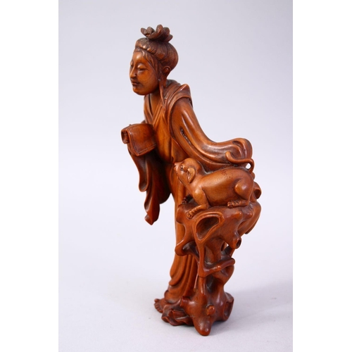 357 - A CHINESE CARVED WOODEN FIGURE OF GUANYIN & ANIMAL, stood aside a tree stump with an a animal, 20cm ... 