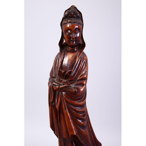 36 - A GOOD JAPANESE MEIJI PERIOD CARVED WOOD OKIMONO OF KWANNON, stood holding a scroll, fitted to a har... 