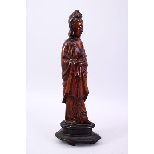 36 - A GOOD JAPANESE MEIJI PERIOD CARVED WOOD OKIMONO OF KWANNON, stood holding a scroll, fitted to a har... 