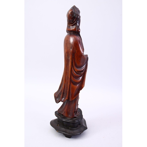 36 - A GOOD JAPANESE MEIJI PERIOD CARVED WOOD OKIMONO OF KWANNON, stood holding a scroll, fitted to a har... 