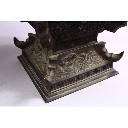 362 - A LARGE & HEAVY PAIR OF JAPANESE BRONZE RELIEF DRAGON VASES, carved in relief with dragons and waves... 