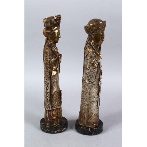 366 - A PAIR OF 19TH / 20TH CENTURY GILT WHITE METAL FIGURES OF EMPEROR AND EMPRESS, both depicted weating... 