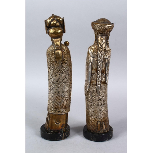 366 - A PAIR OF 19TH / 20TH CENTURY GILT WHITE METAL FIGURES OF EMPEROR AND EMPRESS, both depicted weating... 