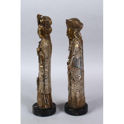 366 - A PAIR OF 19TH / 20TH CENTURY GILT WHITE METAL FIGURES OF EMPEROR AND EMPRESS, both depicted weating... 