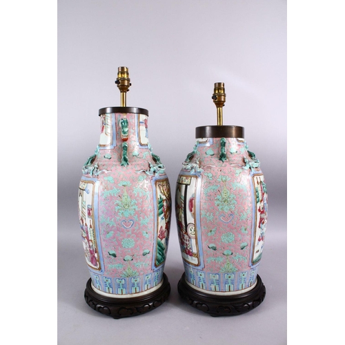 372 - A GOOD PAIR OF 19TH CENTURY CANTON CHINESE FAMILLE ROSE PORCELAIN VASES, the body with a pink ground... 