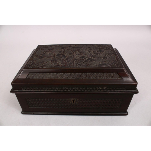 38 - A GOOD 20TH CENTURY CHINESE CARVED WOODEN METAL LINED TEA CADDY, the box carved with native floral s... 