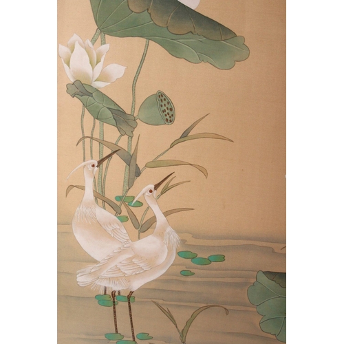 386 - A LARGE CHINESE PICTURE OF CRANES around a lily pond, 76cm x 107cm.