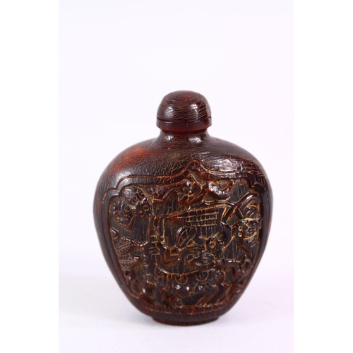 392 - A 19TH CENTURY CHINESE CARVED HORN SNUFF BOTTLE, carved with scenes of an immortal with deer, in lan... 