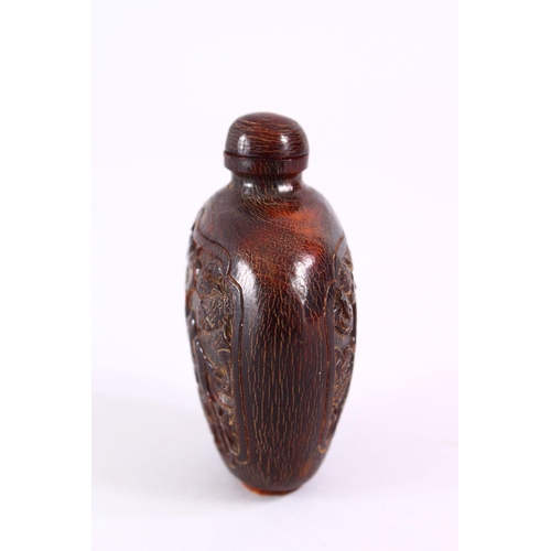 392 - A 19TH CENTURY CHINESE CARVED HORN SNUFF BOTTLE, carved with scenes of an immortal with deer, in lan... 