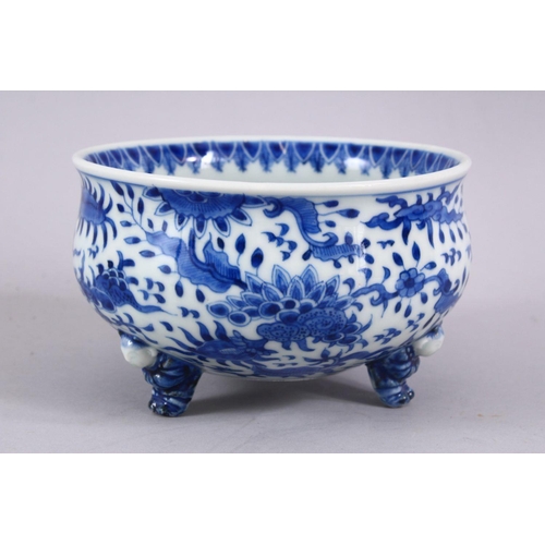 394 - A JAPANESE MEIJI PERIOD BLUE & WHITE TRIPOD BOWL, decorated with an interior scene of a village, the... 