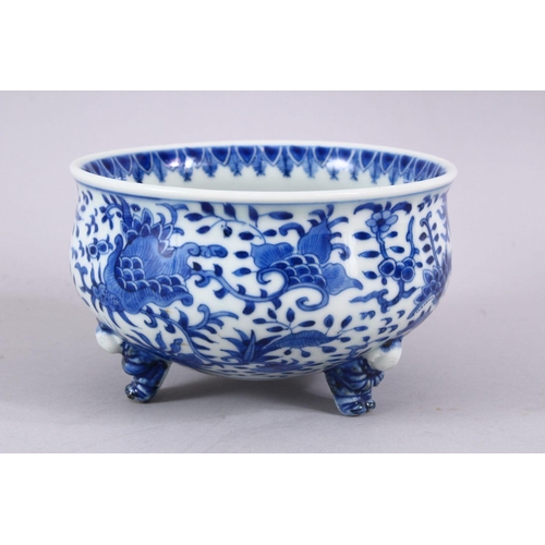 394 - A JAPANESE MEIJI PERIOD BLUE & WHITE TRIPOD BOWL, decorated with an interior scene of a village, the... 