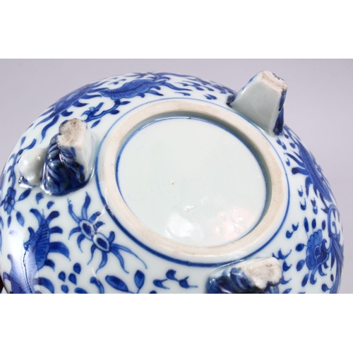 394 - A JAPANESE MEIJI PERIOD BLUE & WHITE TRIPOD BOWL, decorated with an interior scene of a village, the... 