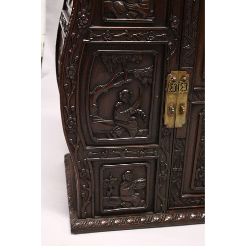 397 - A GOOD 19TH CENTURY CHINESE CARVED HARDWOOD / HONGMU CABINET ON STAND, the cabinet with an opening d... 