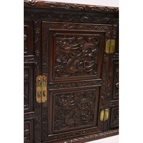 397 - A GOOD 19TH CENTURY CHINESE CARVED HARDWOOD / HONGMU CABINET ON STAND, the cabinet with an opening d... 