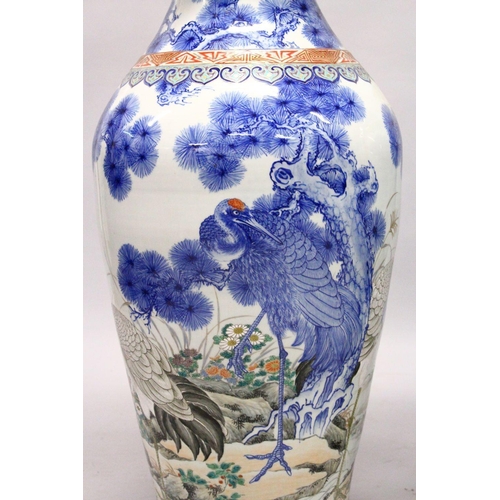 398 - A LARGE PAIR OF JAPANESE MEIJI PERIOD BLUE AND WHITE PORCELAIN IMARI VASES, the body of the vases de... 