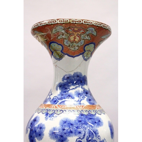 398 - A LARGE PAIR OF JAPANESE MEIJI PERIOD BLUE AND WHITE PORCELAIN IMARI VASES, the body of the vases de... 