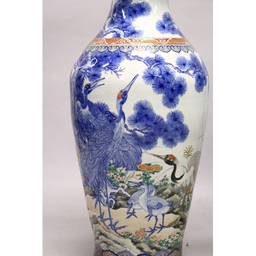 398 - A LARGE PAIR OF JAPANESE MEIJI PERIOD BLUE AND WHITE PORCELAIN IMARI VASES, the body of the vases de... 