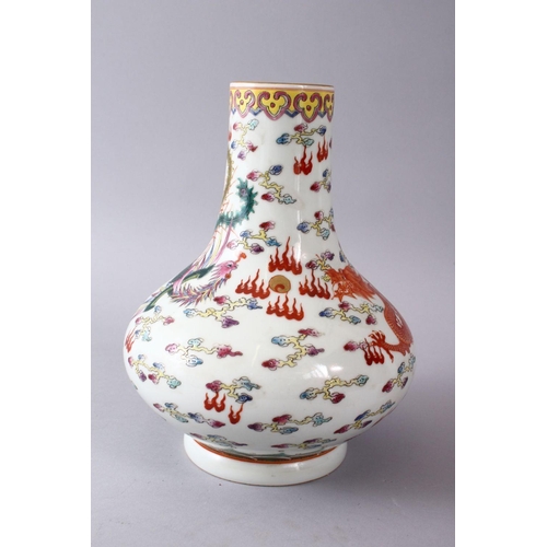 40 - A CHINESE FAMILLE ROSE PORCELAIN BOTTLE SHAPED VASE, decorated with an iron red dragon & phoenix amo... 