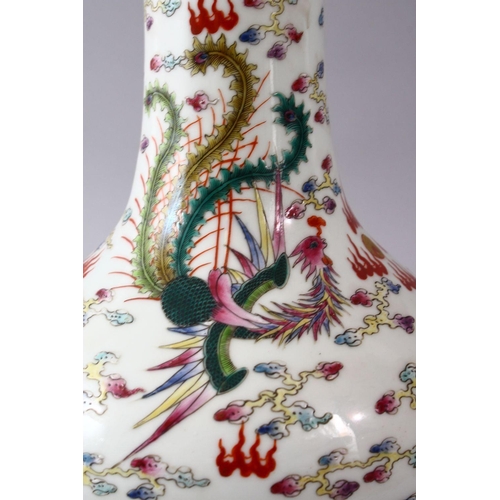 40 - A CHINESE FAMILLE ROSE PORCELAIN BOTTLE SHAPED VASE, decorated with an iron red dragon & phoenix amo... 