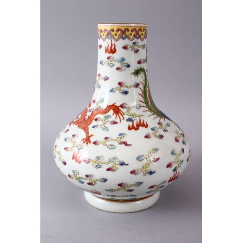 40 - A CHINESE FAMILLE ROSE PORCELAIN BOTTLE SHAPED VASE, decorated with an iron red dragon & phoenix amo... 